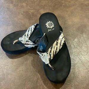 Women’s Yellow Box hair on hide flip flops.